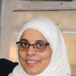 ward-storyteller_adhela-1 Ahdela with her husband, Salah, at their restaurant in 2017. Photo Credit: Kathy Grant