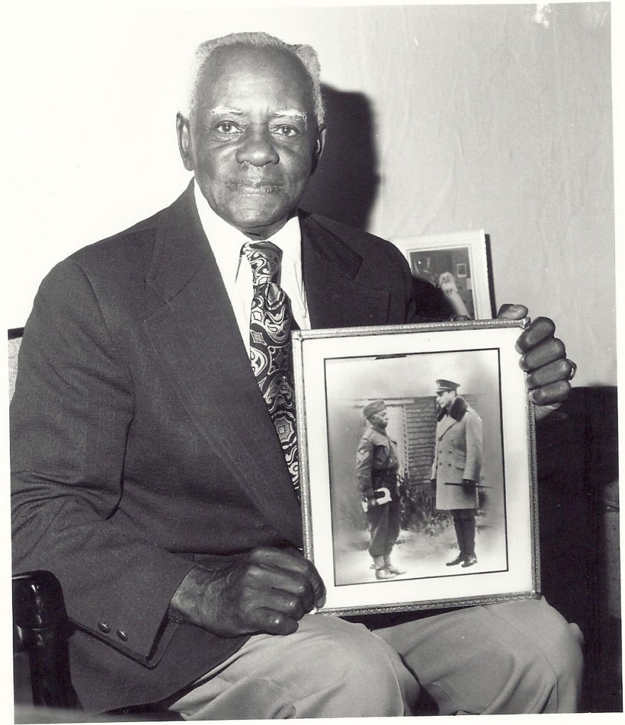 Sgt Arthur Seymour Tyler holds a picture of King George VI admiring his silver bugle received from his York-Carleton regiment. Courtesy of Beulah Palmer, daughter of Arthur Seymour Tyler. Sgt Arthur Seymour Tyler holds a picture of King George VI admiring his silver bugle received from his York-Carleton regiment. Courtesy of Beulah Palmer, daughter of Arthur Seymour Tyler.